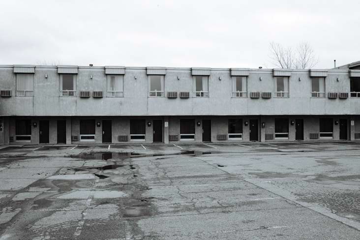 12 Empty Motel Lot, Niagara Falls.  Seeing this instinctively made us stop to document. It was a photojournalistic opportunity to show the impact of the pandemic on profitable economic niches like tourism and entertainment. (11, 12, 13, 14)