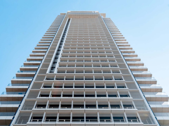 A tall condo or apartment tower.